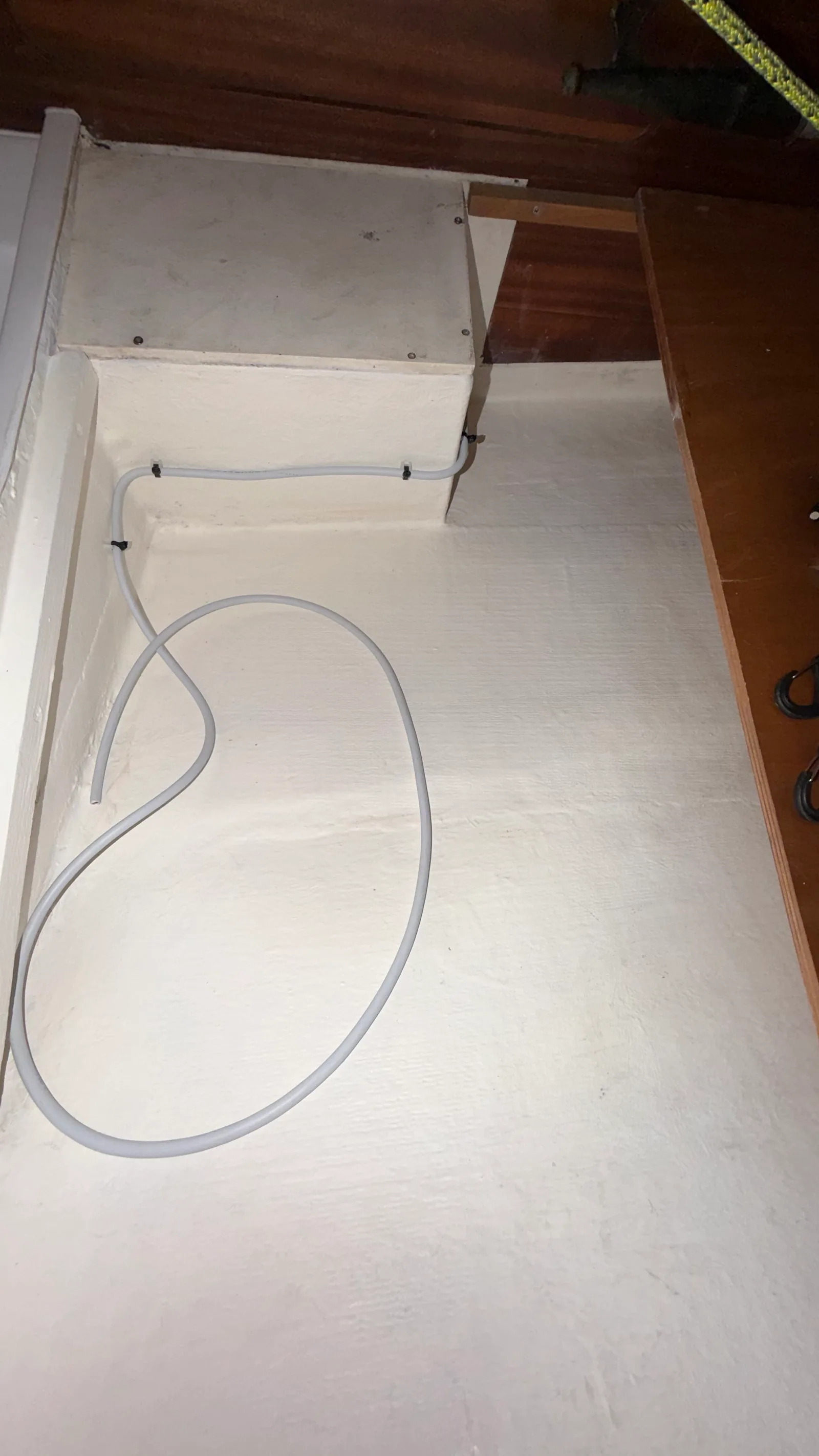 J/92s interior bulkheads after repair: wood/polyester joint re-bonded with epoxy and refinished with spray gelcoat, port bilge repainted — the interior set right before launch