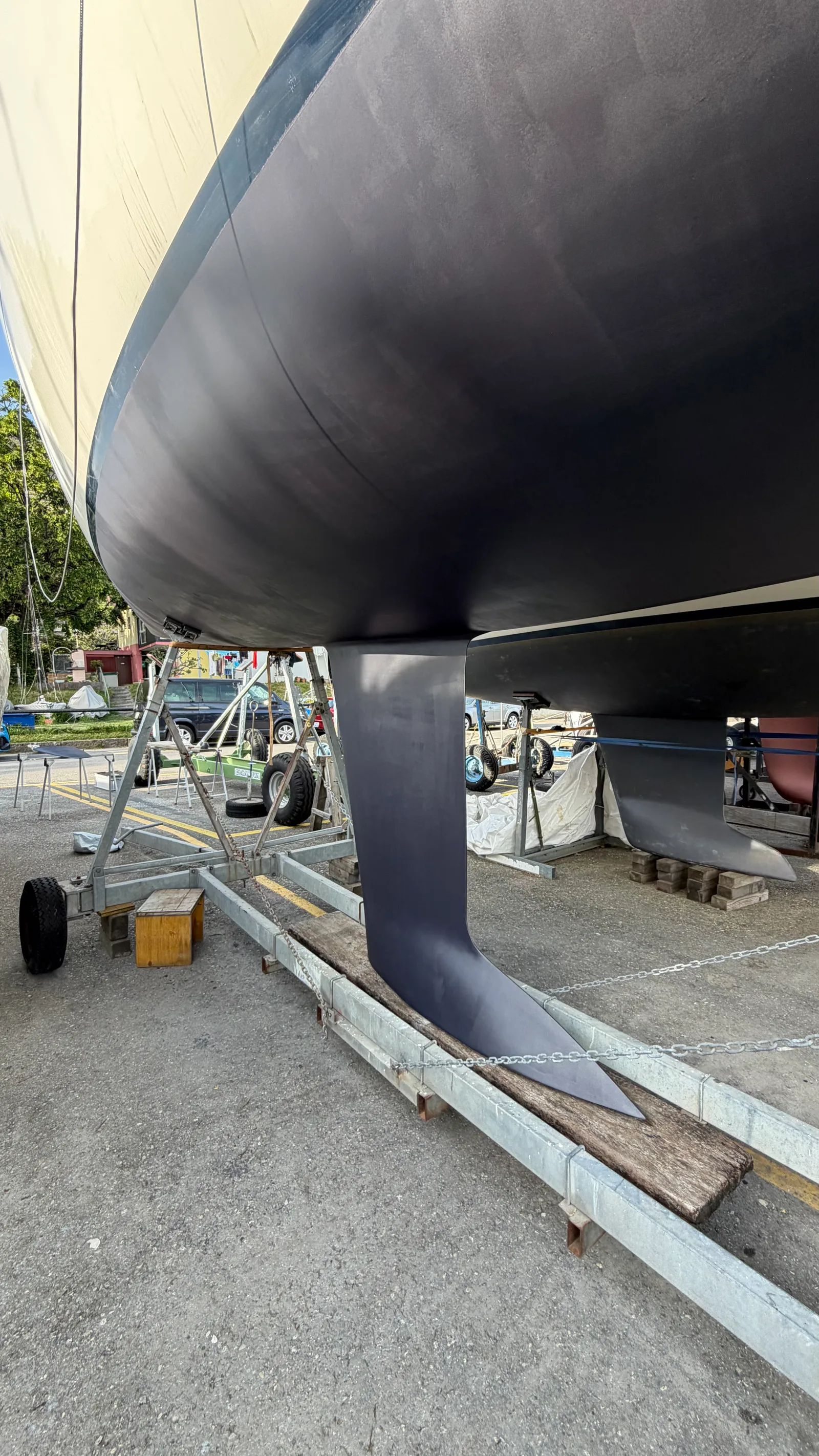 J/92s hull after three coats of Thin Film Graphite antifouling, even colour and smooth finish — ready to relaunch