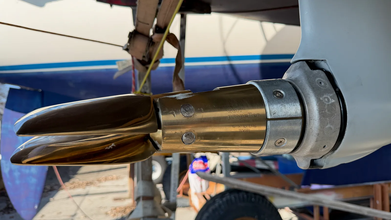 Polished folding Gori propeller closed onto the Volvo Sail Drive leg, freshly coated with zinc primer and grey antifouling, new anodes fitted