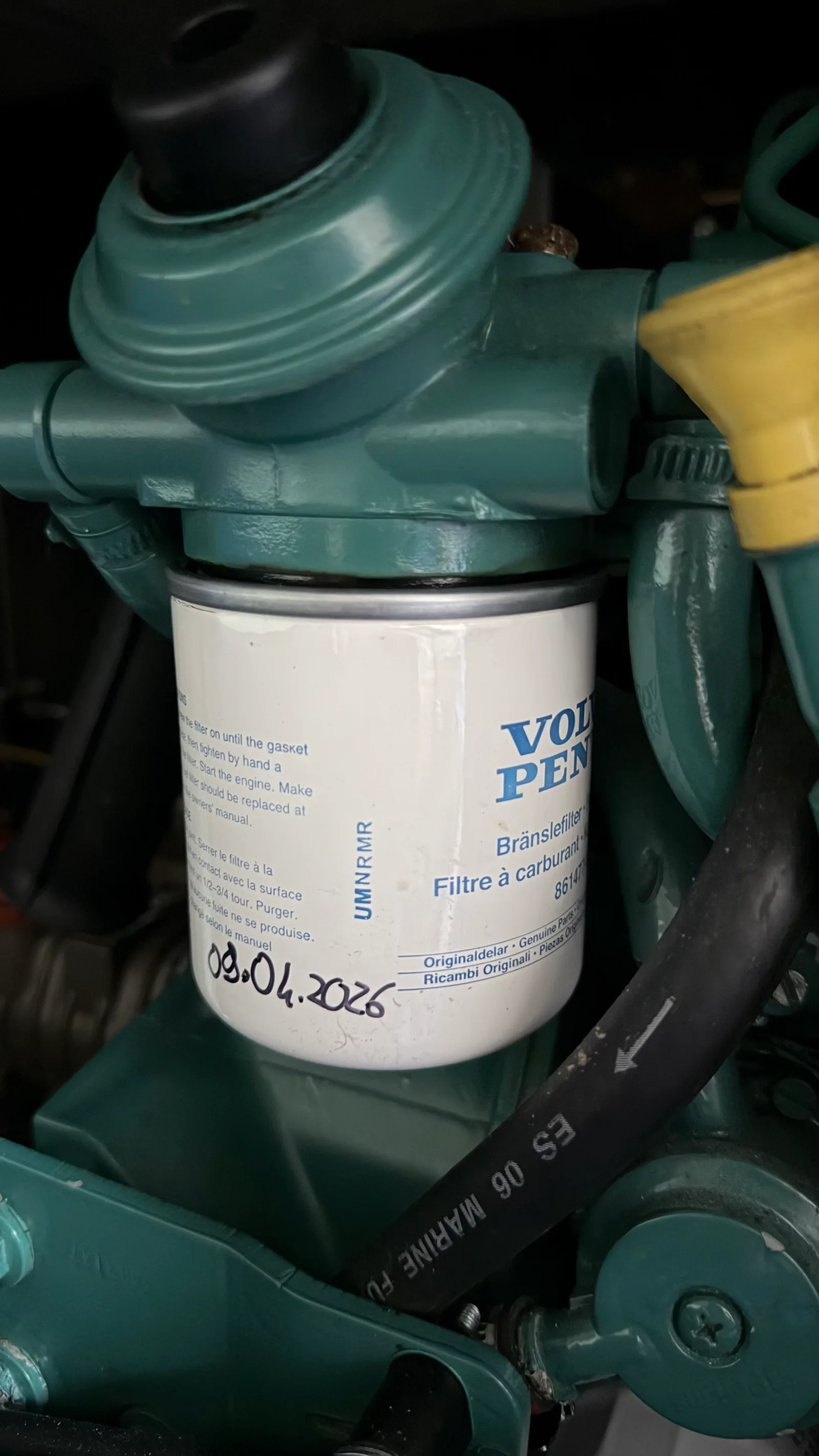 Genuine Volvo Penta fuel filter, fitting date hand-written on the filter body