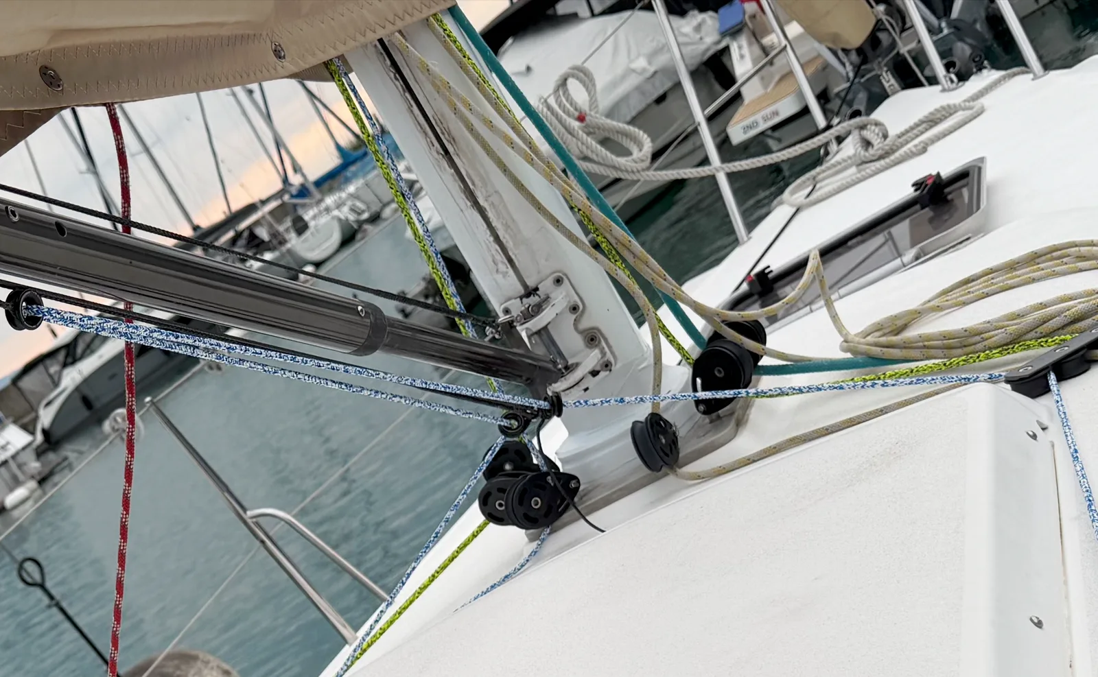 JAMAIS mast foot after the refit: deck partners re-seated, mastcollar tape in place, running rigging led aft along the coach roof